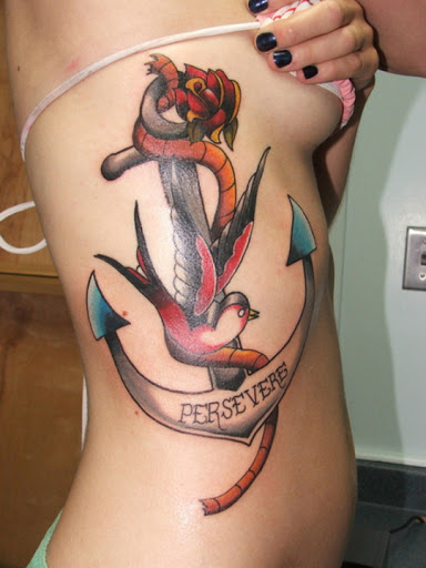 Anchor with bird tattoo design on rib