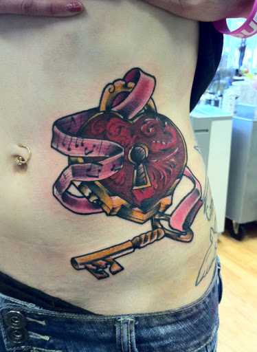 Heart and key tattoos ideas for women on rib