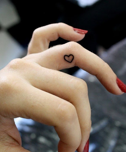Small cute heart tattoos designs on the ring finger
