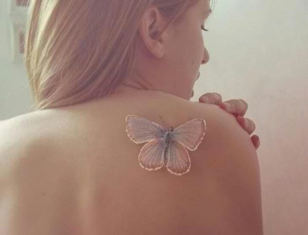 White-ink-butterfly-tattoo-on-back