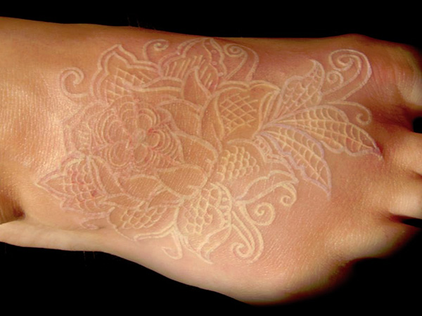 white-ink-foot-tattoo