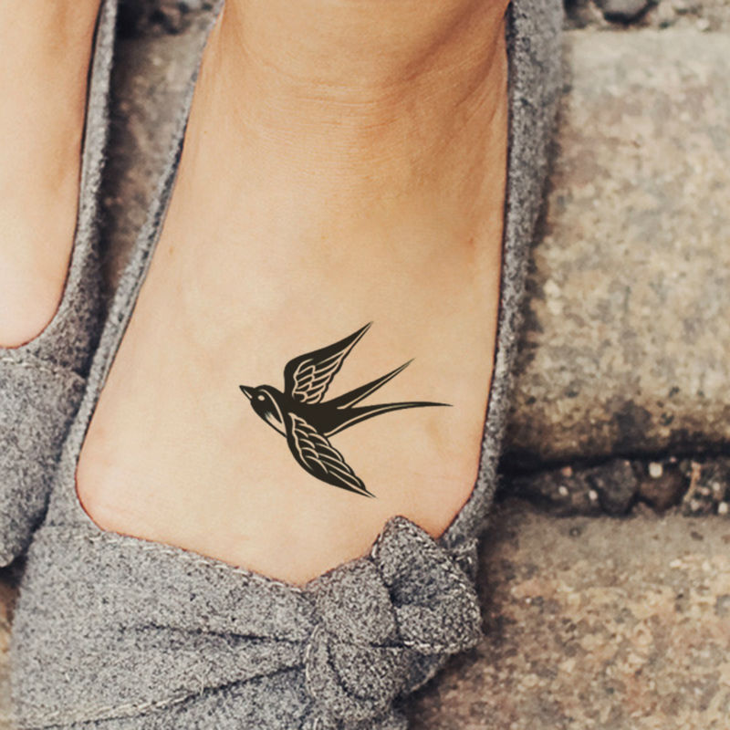 Cute-Black-Swallow-Tattoo-on-Girl-Foot
