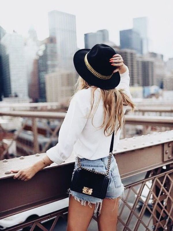 Raw-Hem-Jean-Shorts-With-A-White-Blouse-And-Fedora-Hat