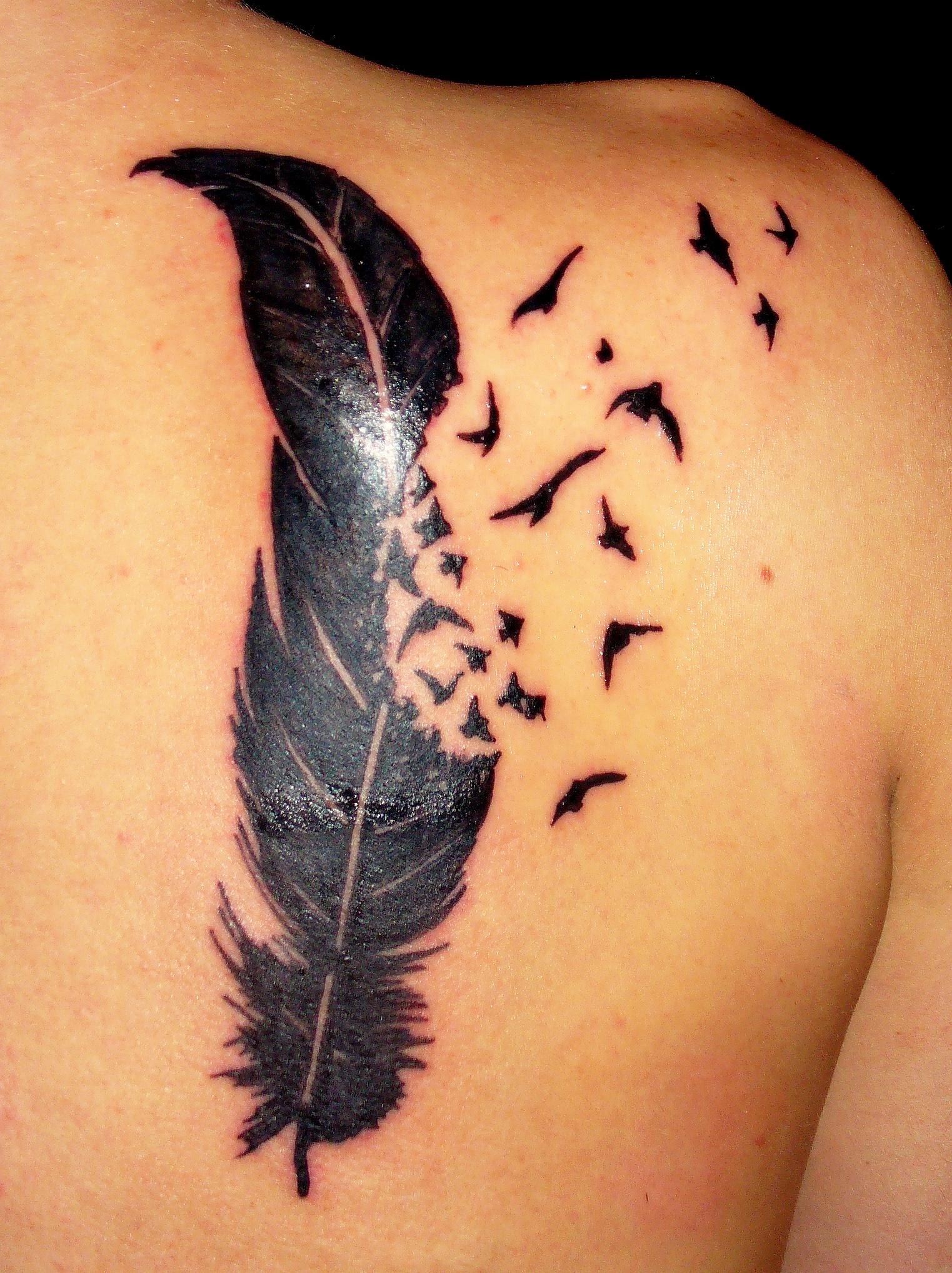 feather-flowers-back-tattoo-