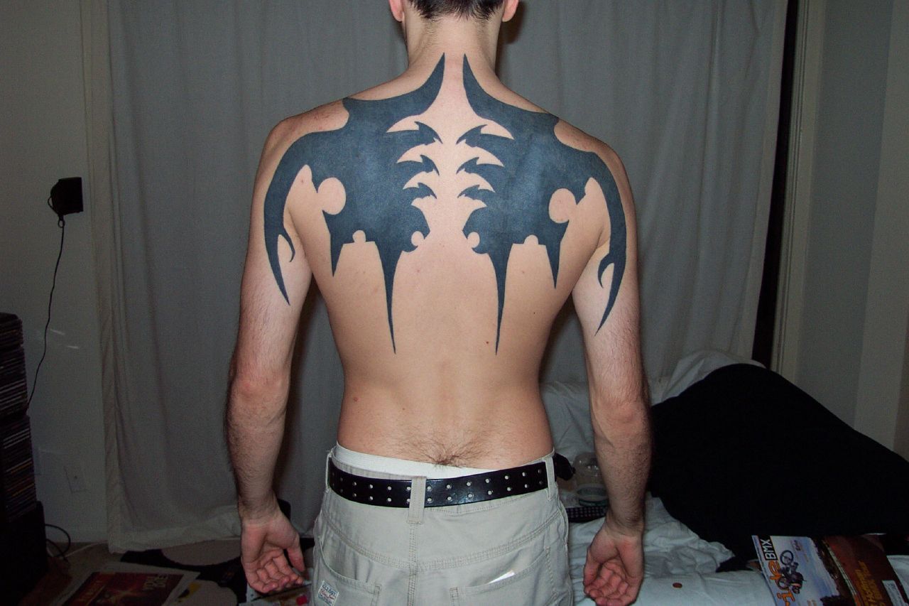 tribal-black-ink-back-tattoo