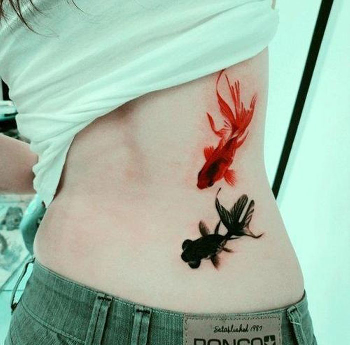 unique-fish-tattoos-girls-lower-back