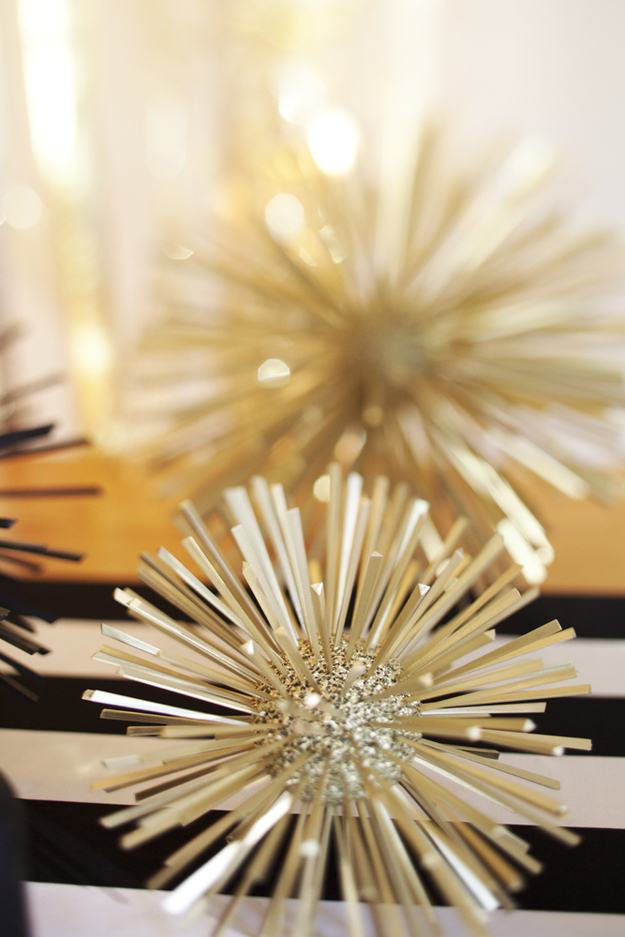 easily-make-these-celestial-spikes-with-glitter-styrofoam-balls-and-spray-painted-toothpicks