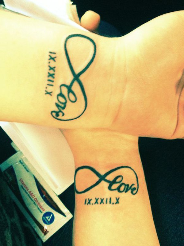 couple-tattoo-love-infinity-with-the-date-in-roman-numerals-on-wrist